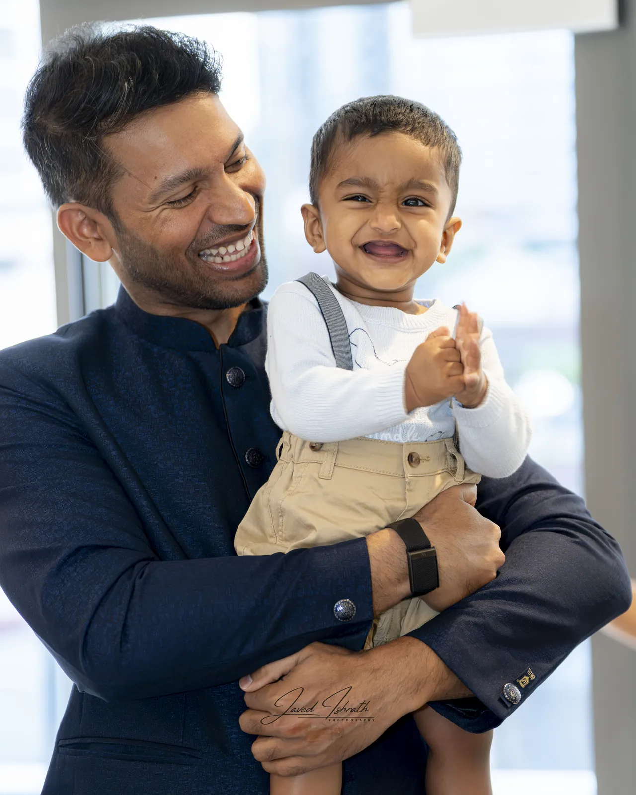 A father and son laughing together
