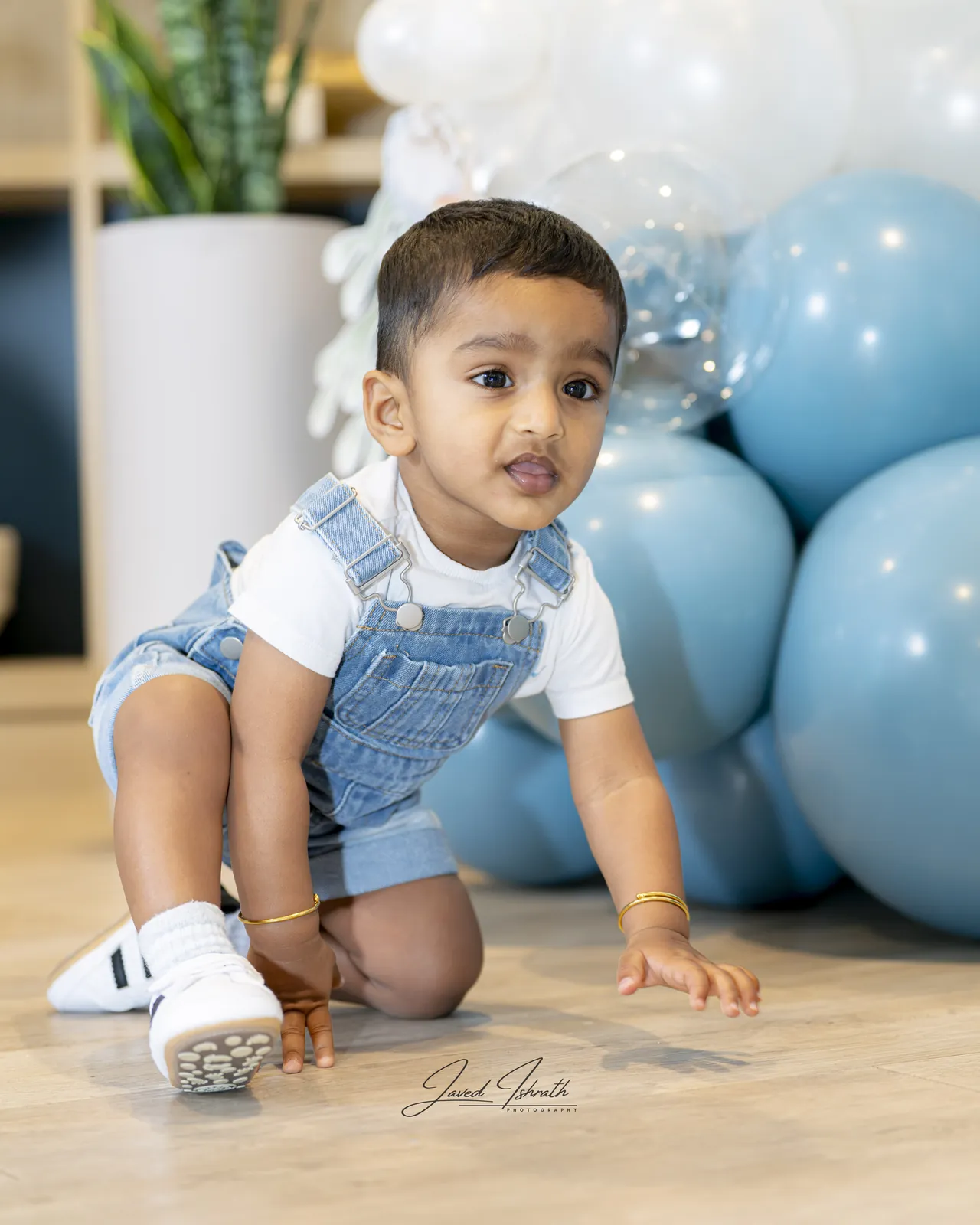 A toddler crawling across the floor